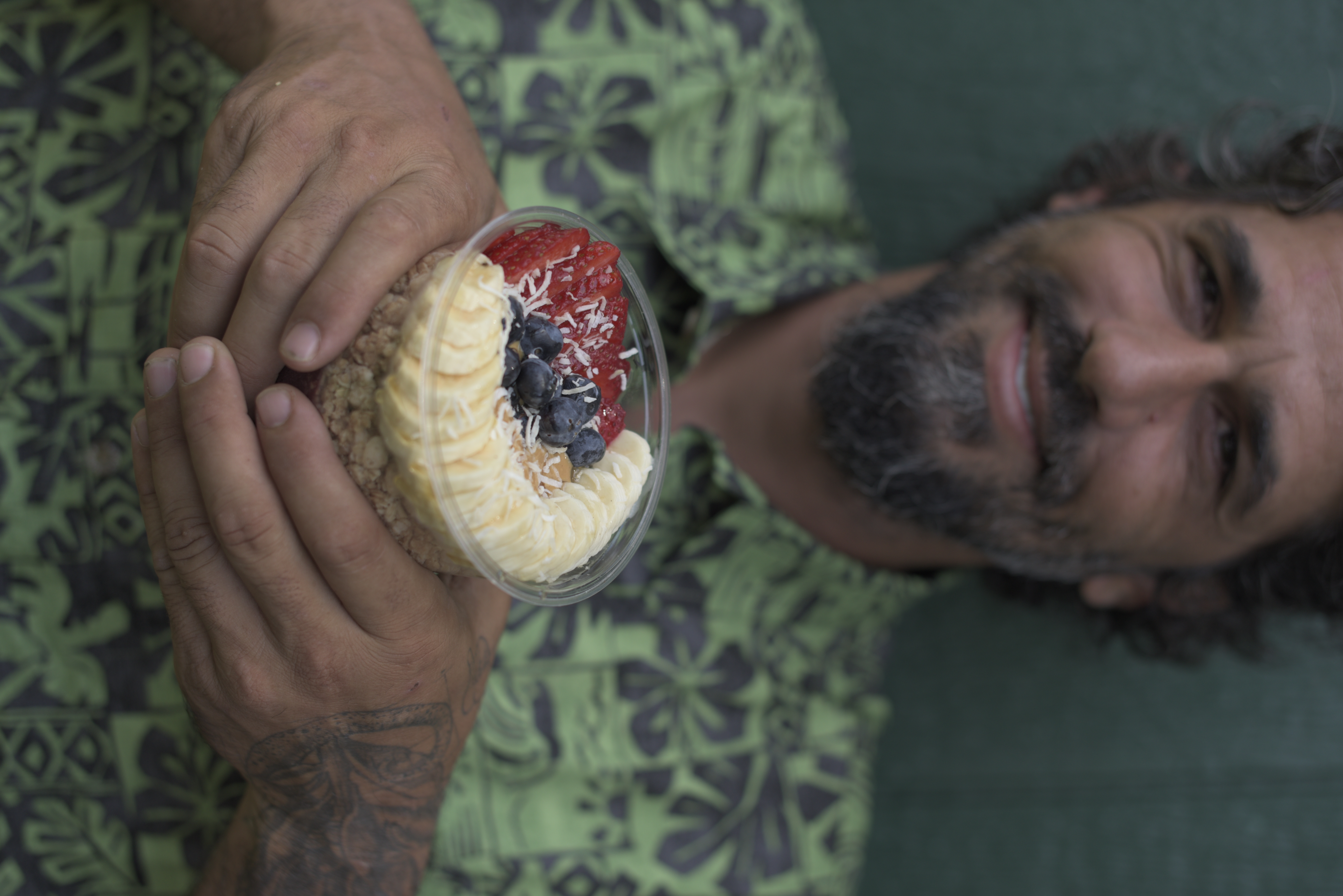 a man holding a bowl of food