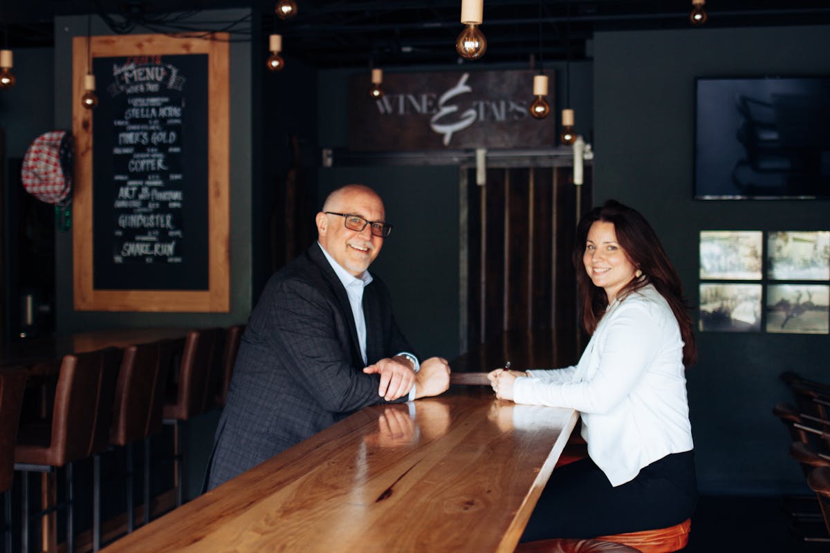 a man and a woman sitting at a table