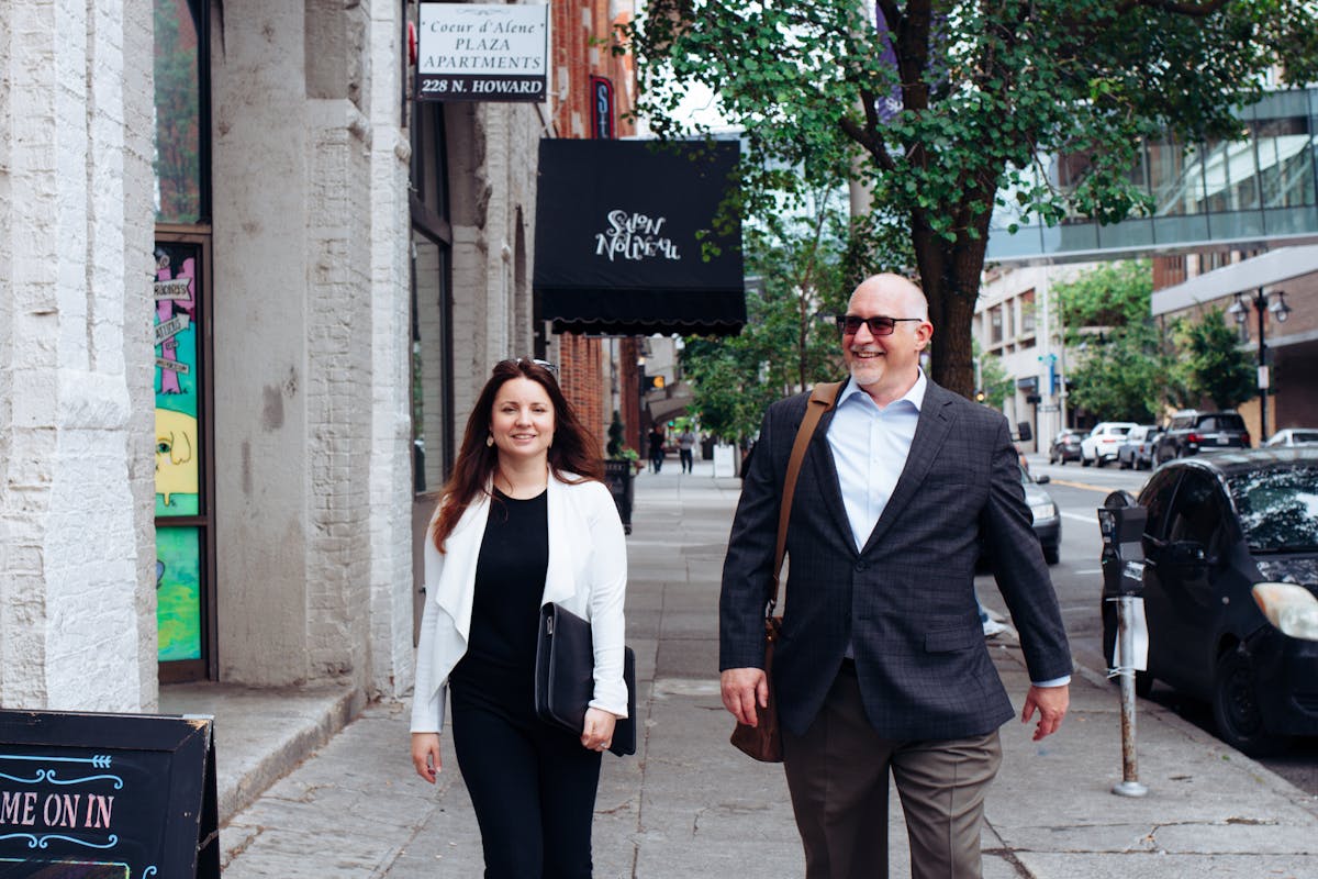 a man and a woman walking down the street