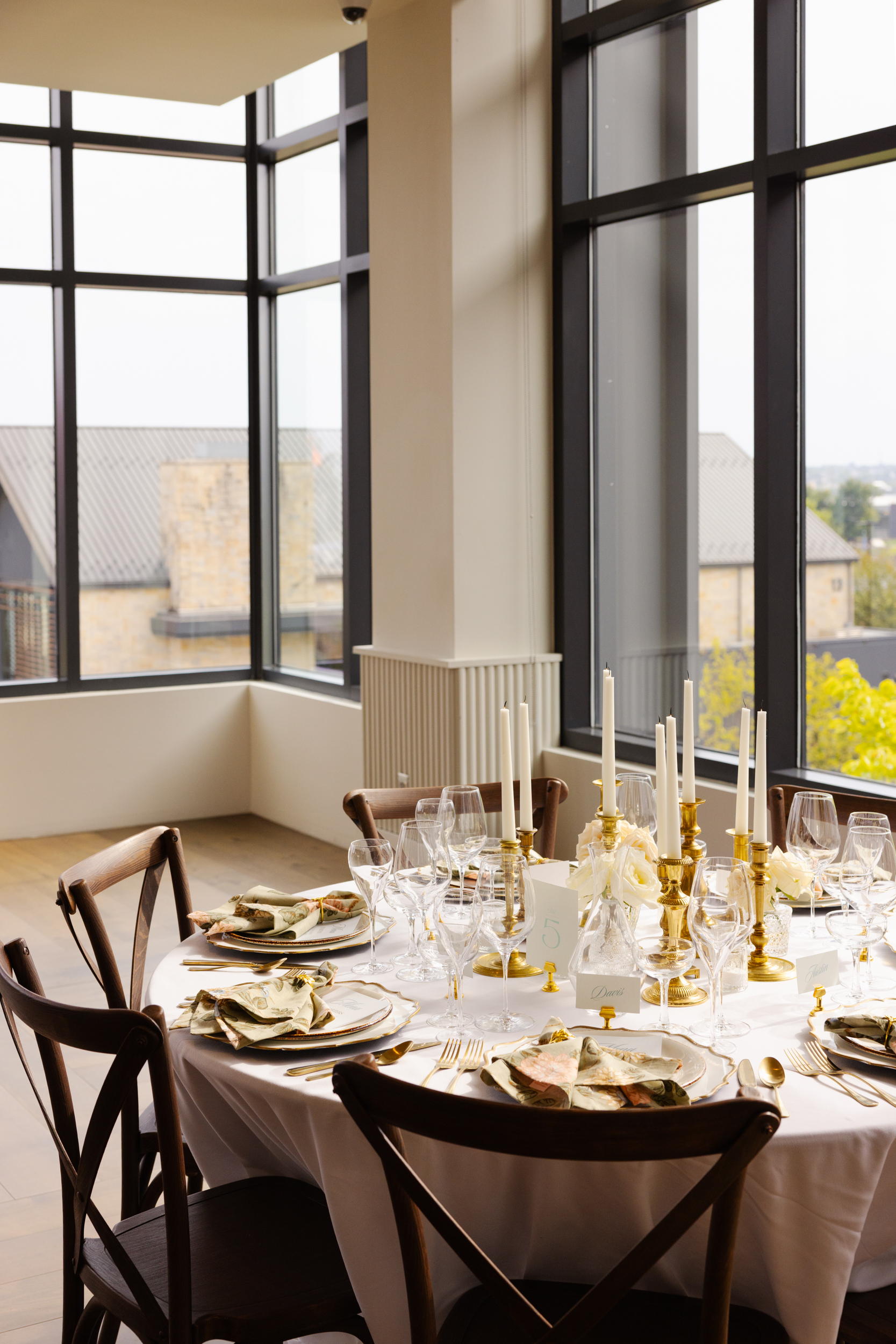 a dining room table in front of a window