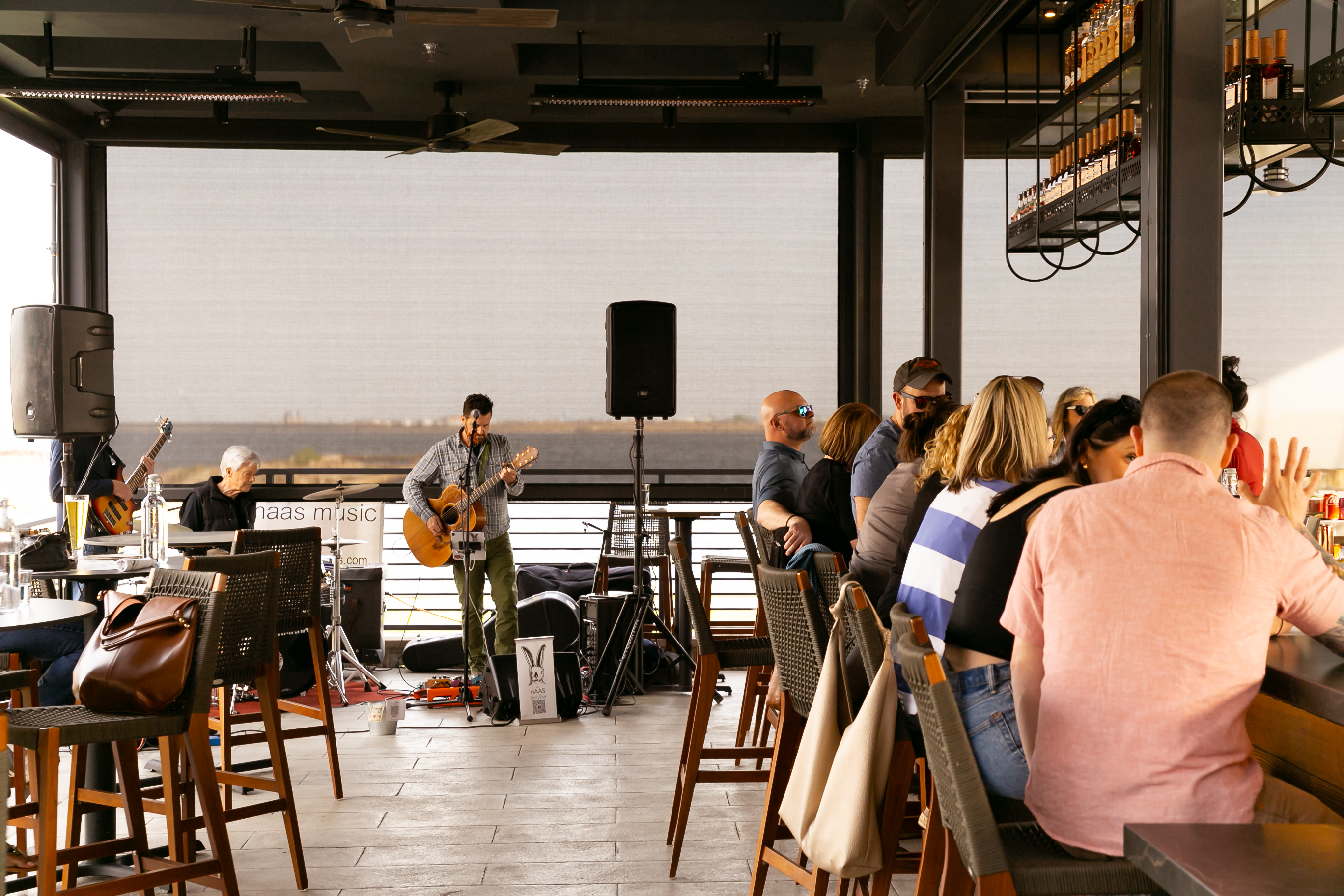 a group of people sitting at a table in a restaurant