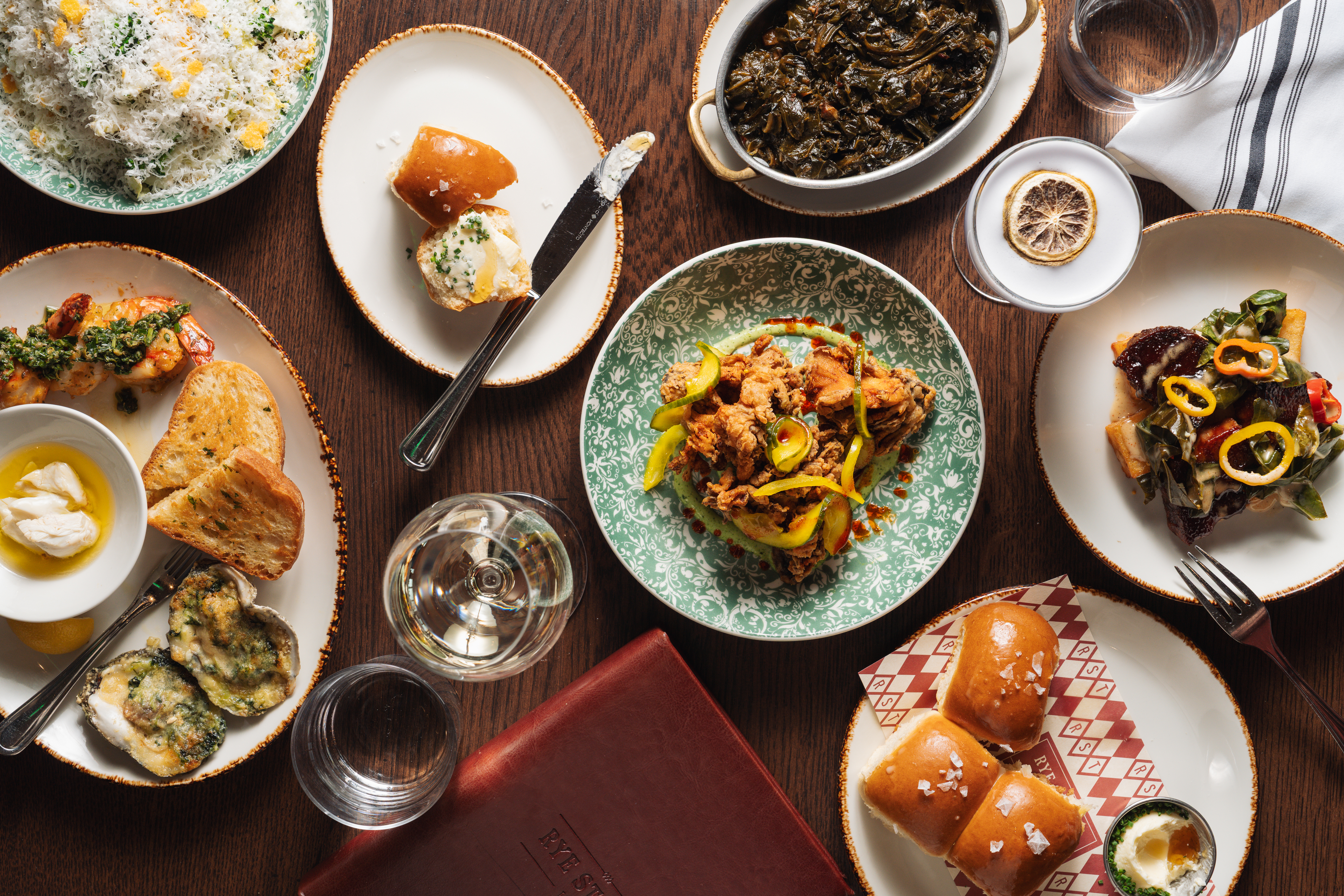 a table with plates of food and drinks