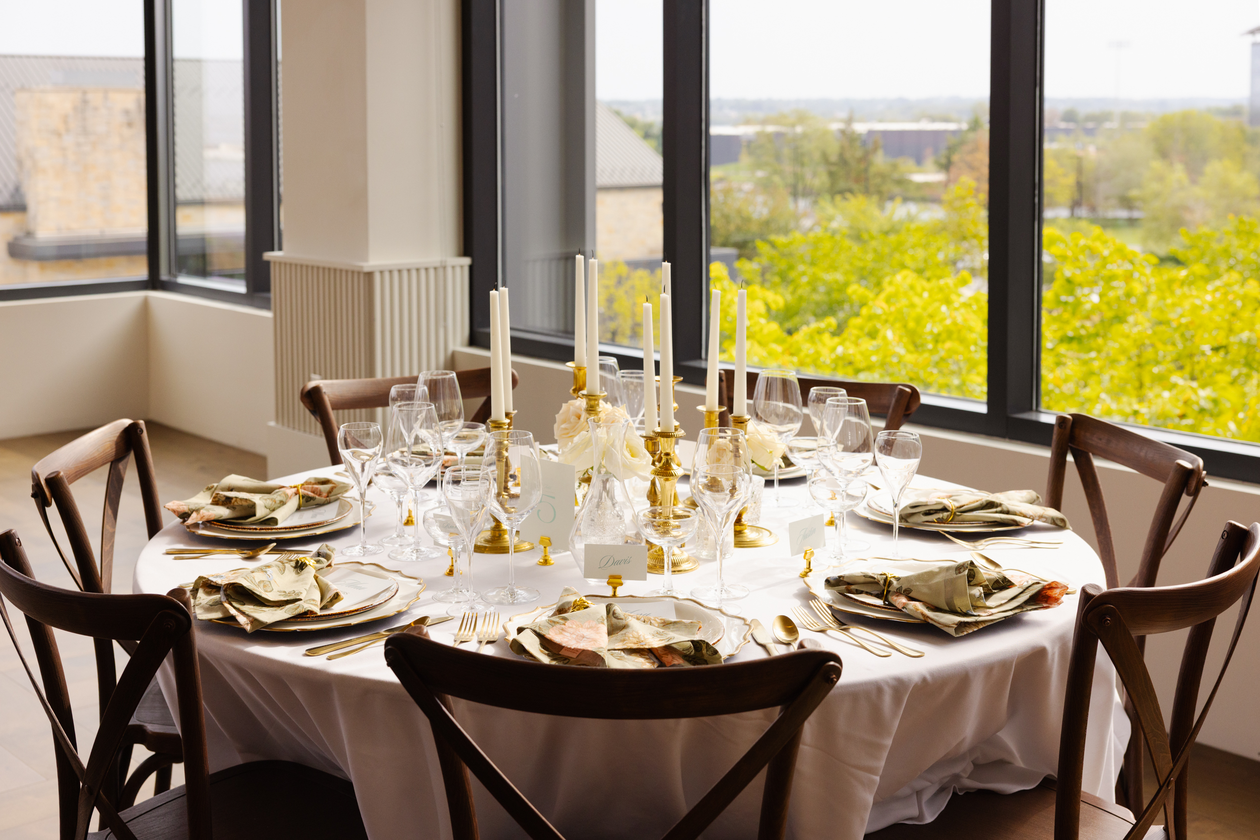 a dining room table in front of a window