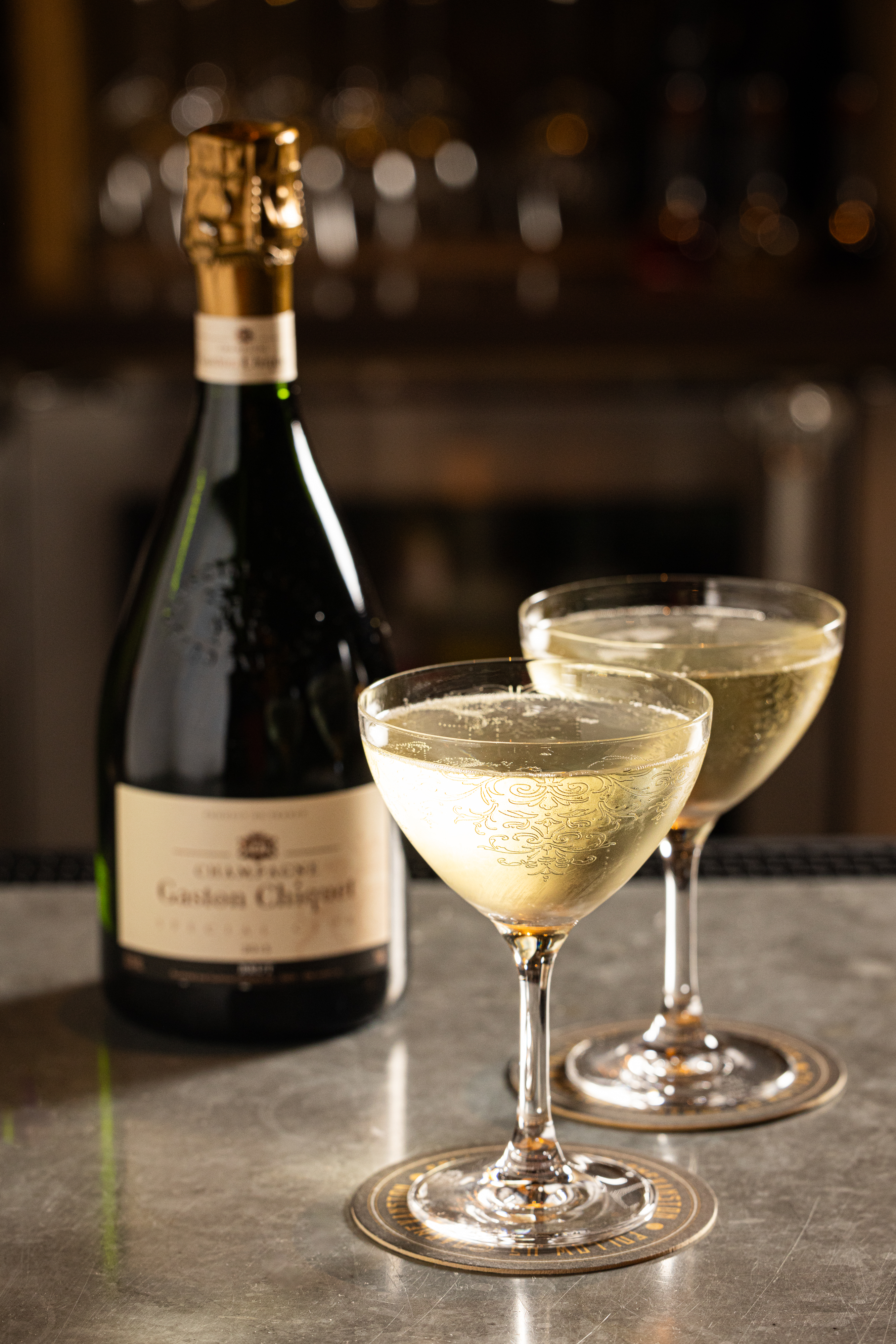 a close up of a bottle and a glass of wine