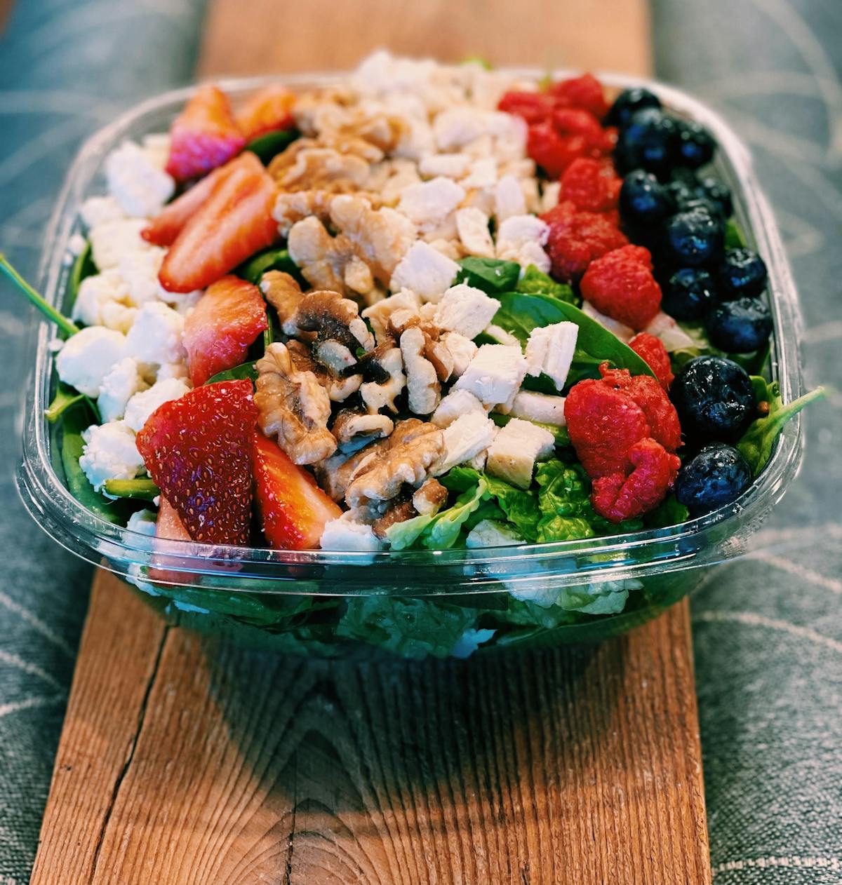 a plate of food sitting on top of a wooden table