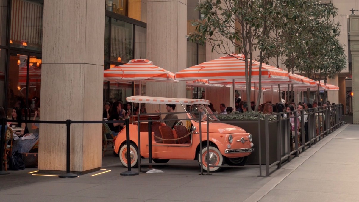 Italian-style patio dining with chic striped umbrellas