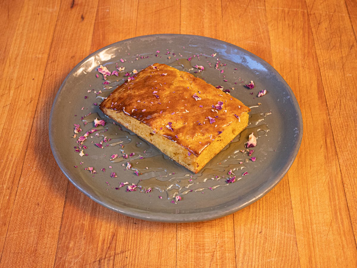 a plate of food sitting on top of a wooden table