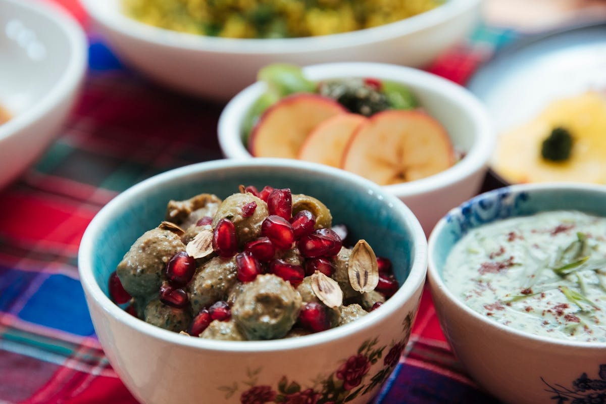 a close up of a bowl of food on a table