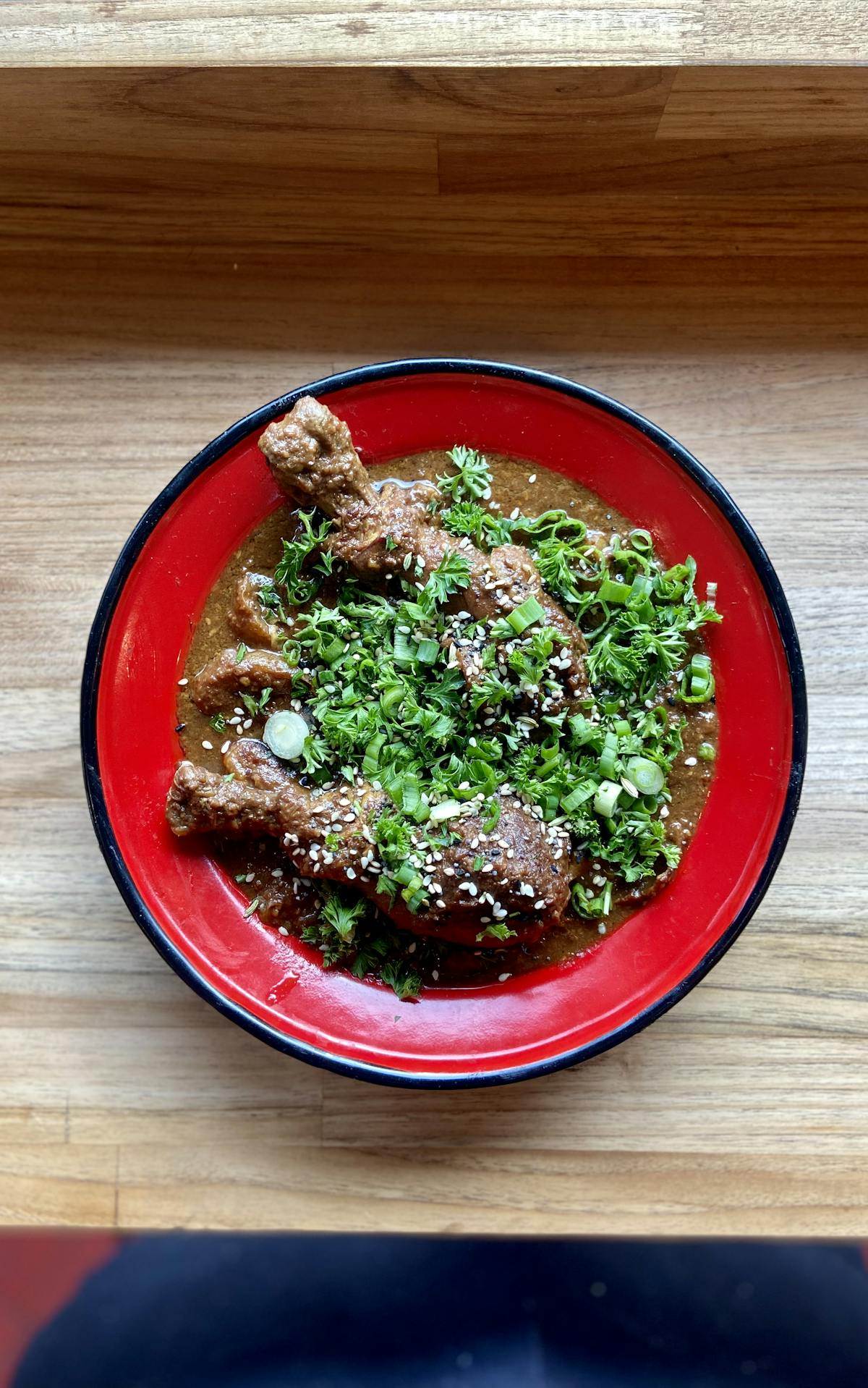 a bowl of food on a wooden table