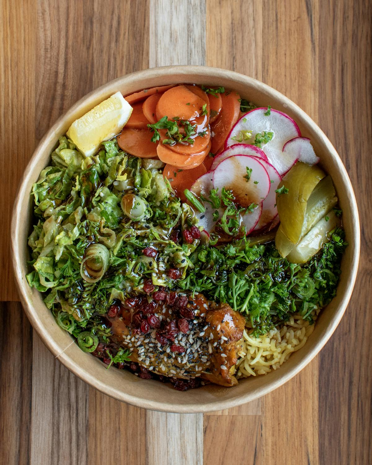 a bowl of food with broccoli