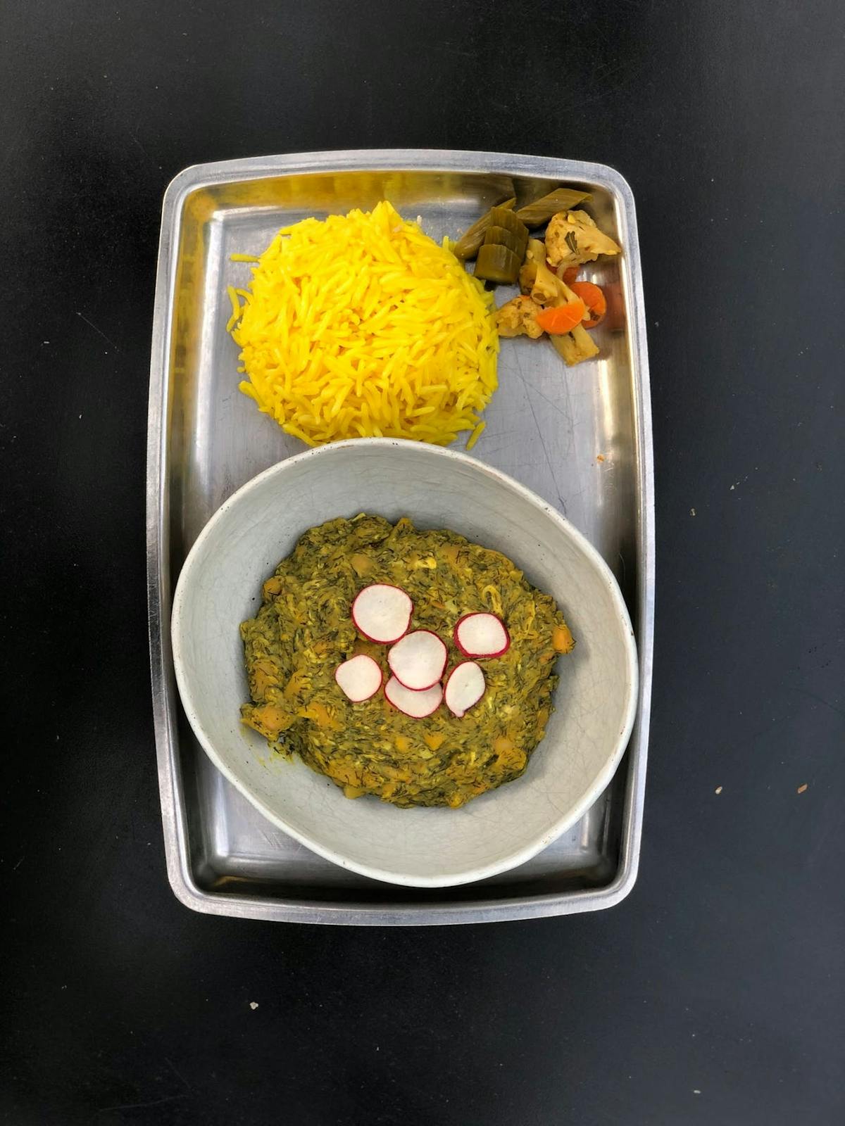 a bowl of food on a tray