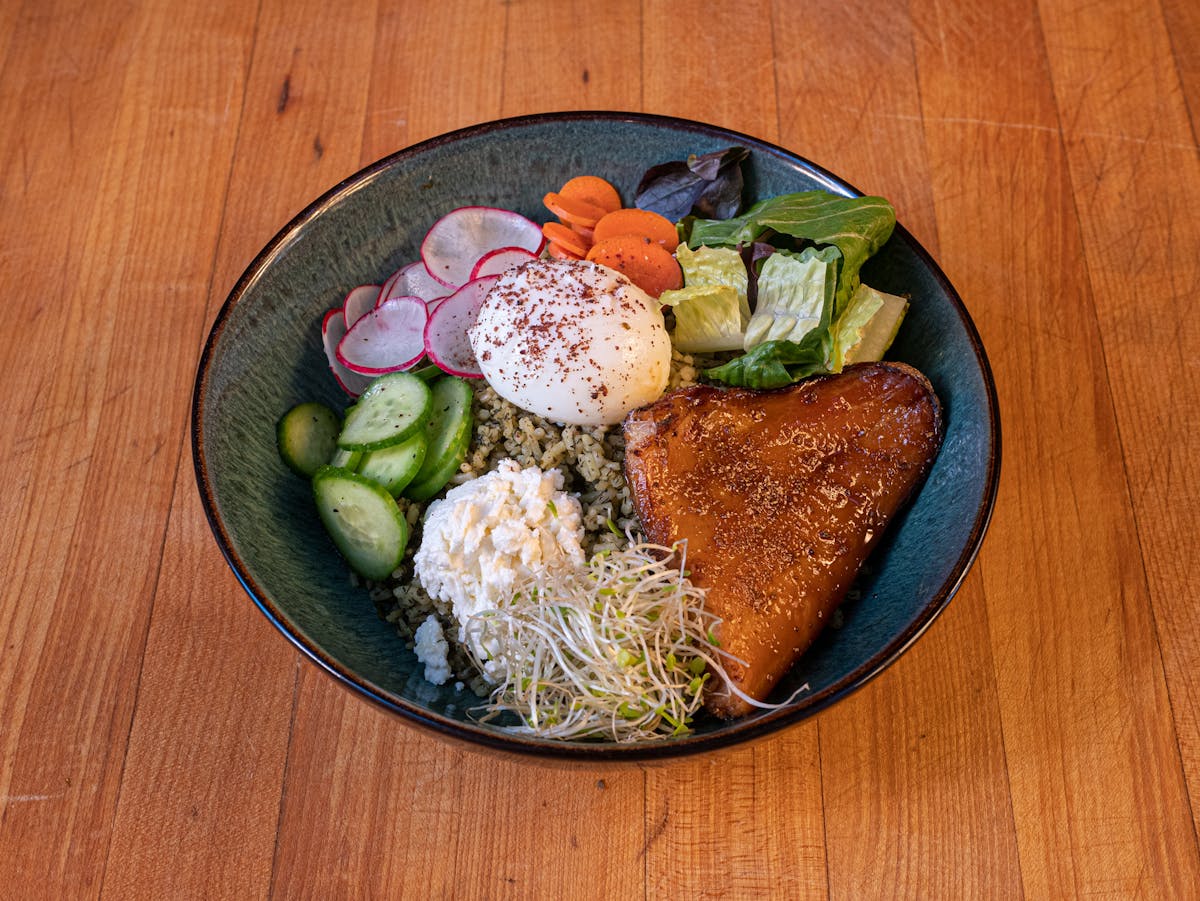 a plate of food sitting on top of a wooden table