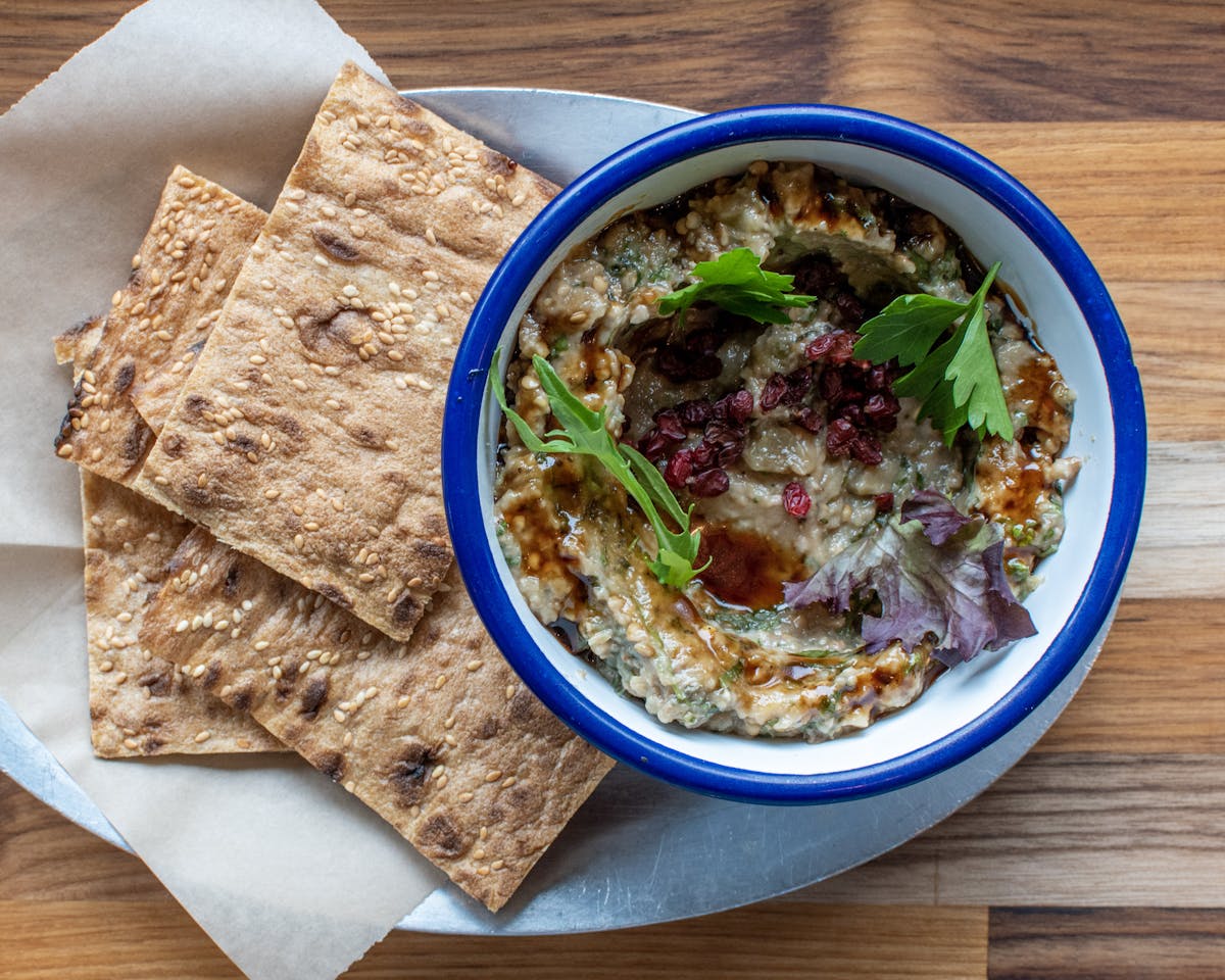 a plate of food sitting on top of a wooden table