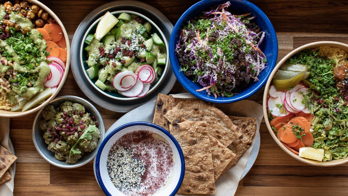 a bowl filled with different types of food on a table