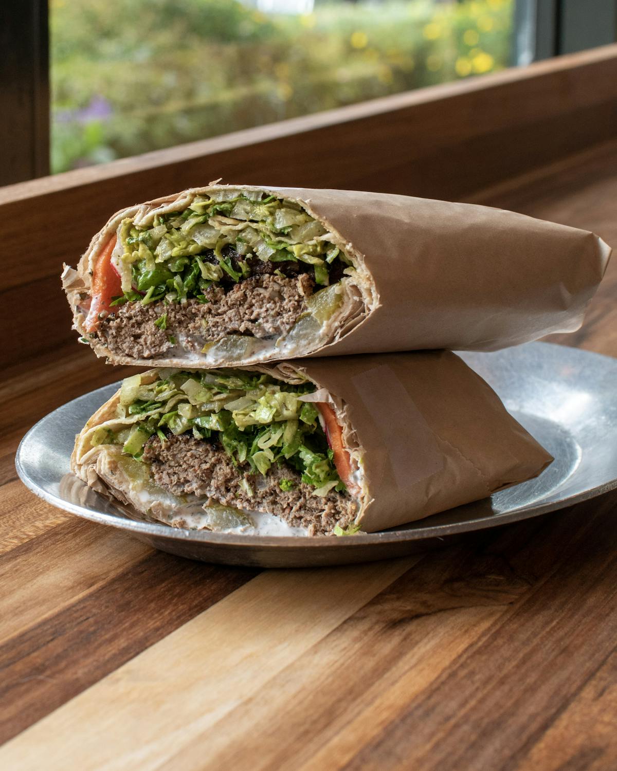 a sandwich sitting on top of a wooden table