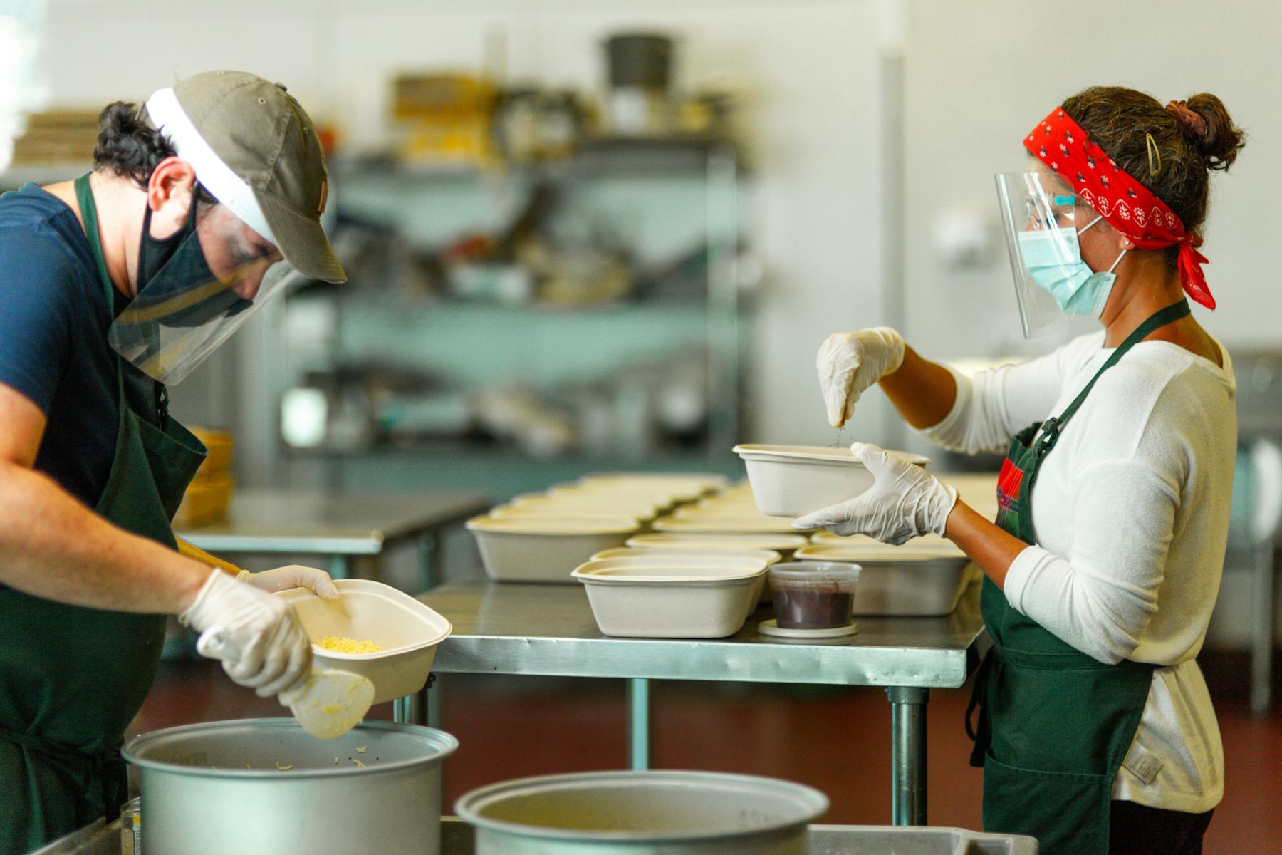 a person standing in a kitchen preparing food