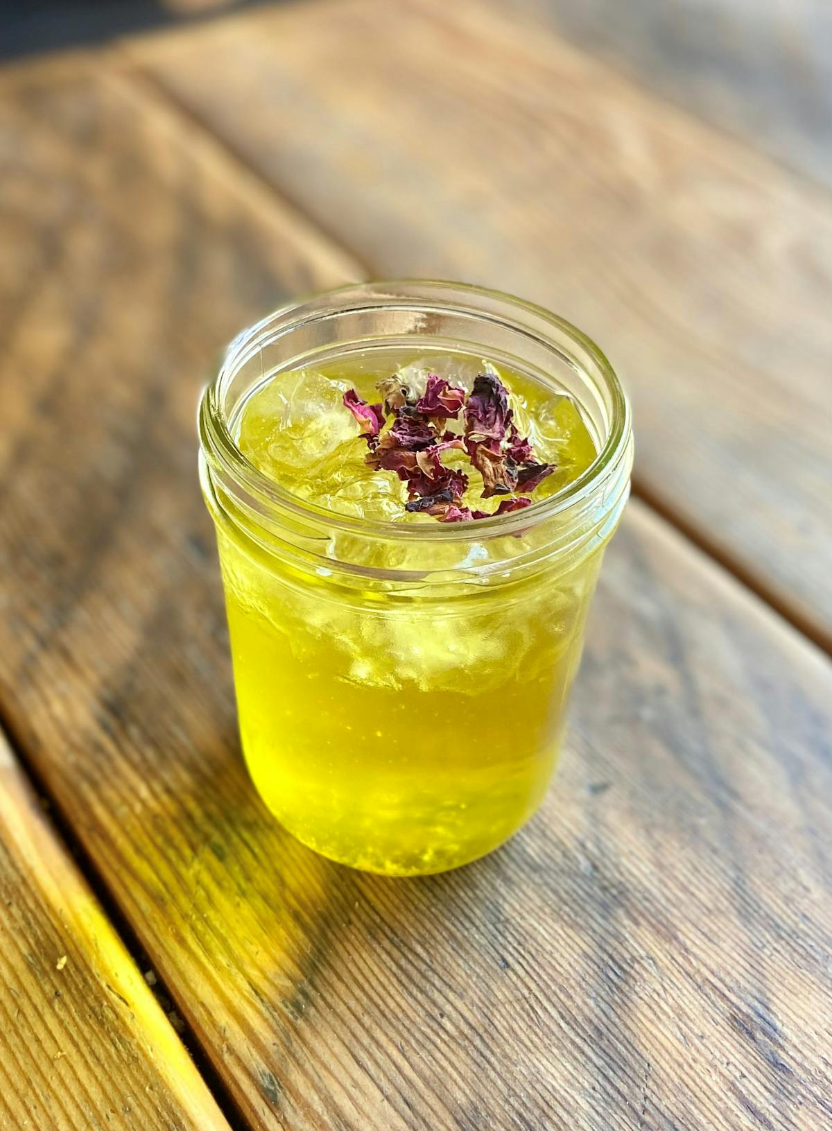 a glass cup on a wooden table
