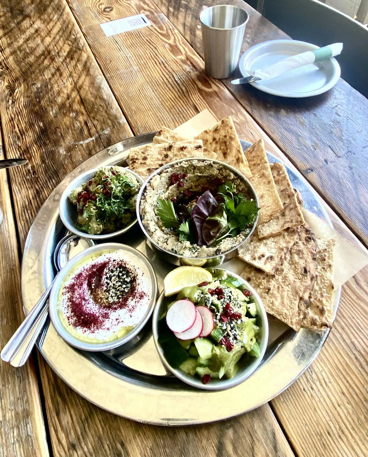 a plate of food on a wooden table