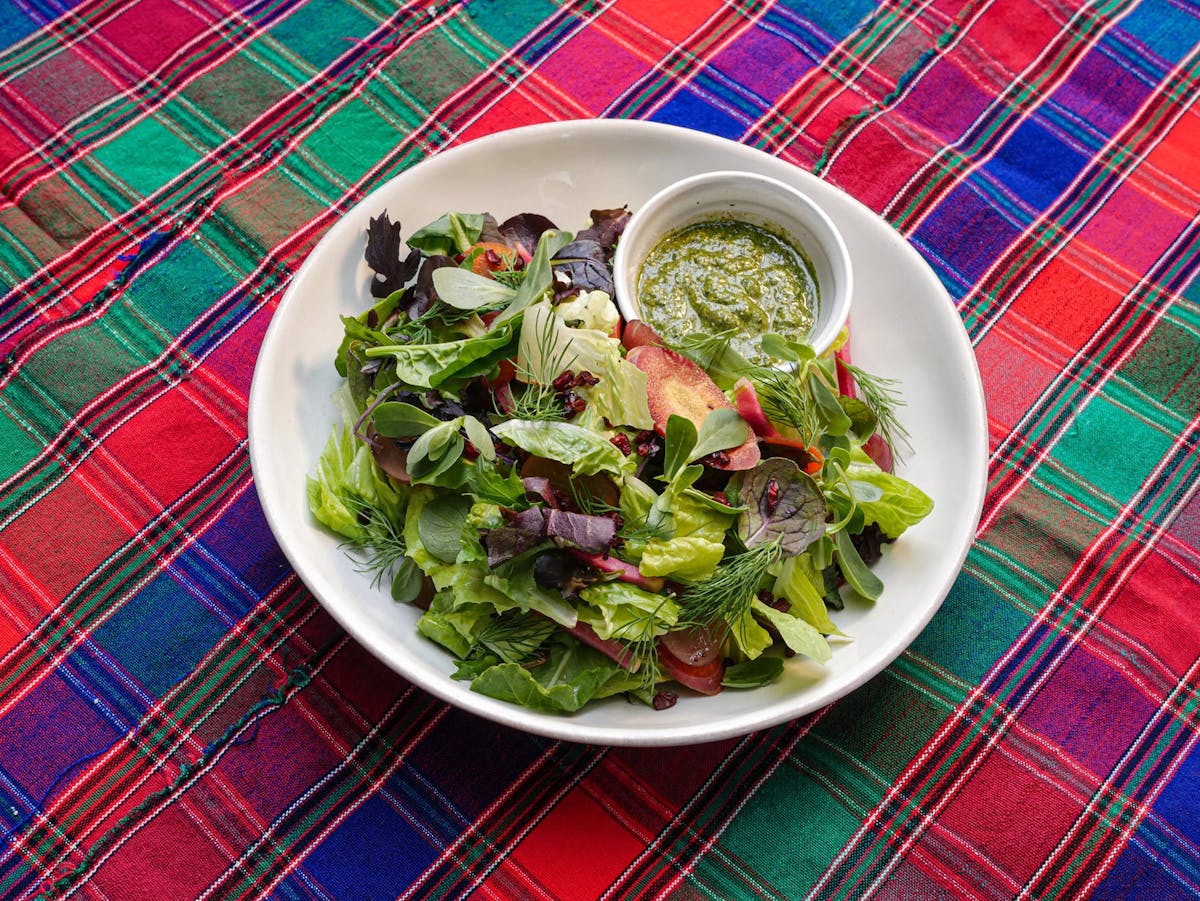 a bowl of salad on a plate