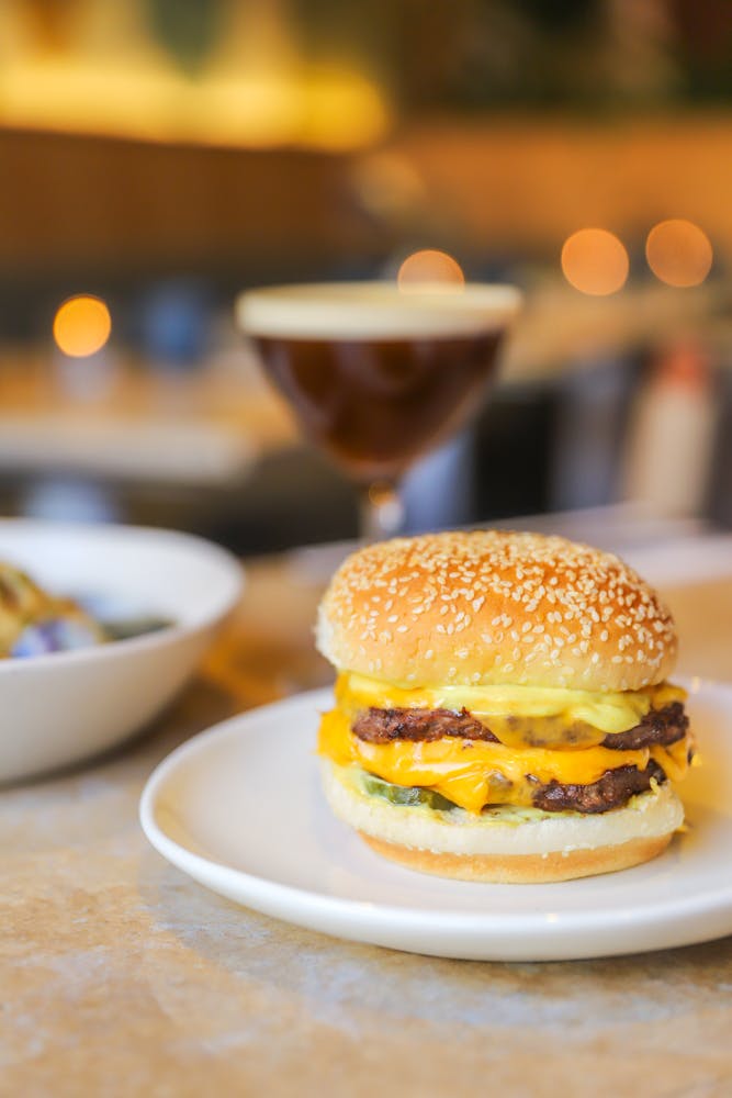 a close up of a plate of food and a cup of coffee