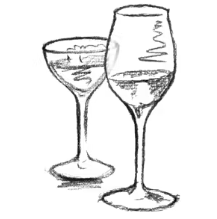 a group of people sitting at a table with a plate of food