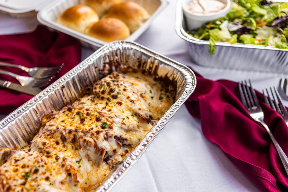 a plate of food with a slice of pizza