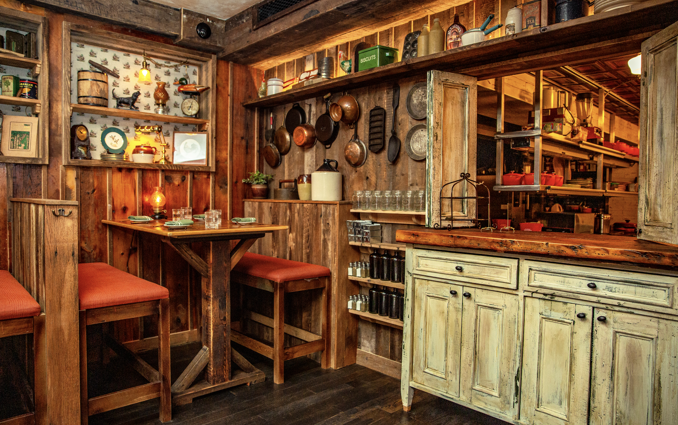 a group of people sitting at a table in front of a store