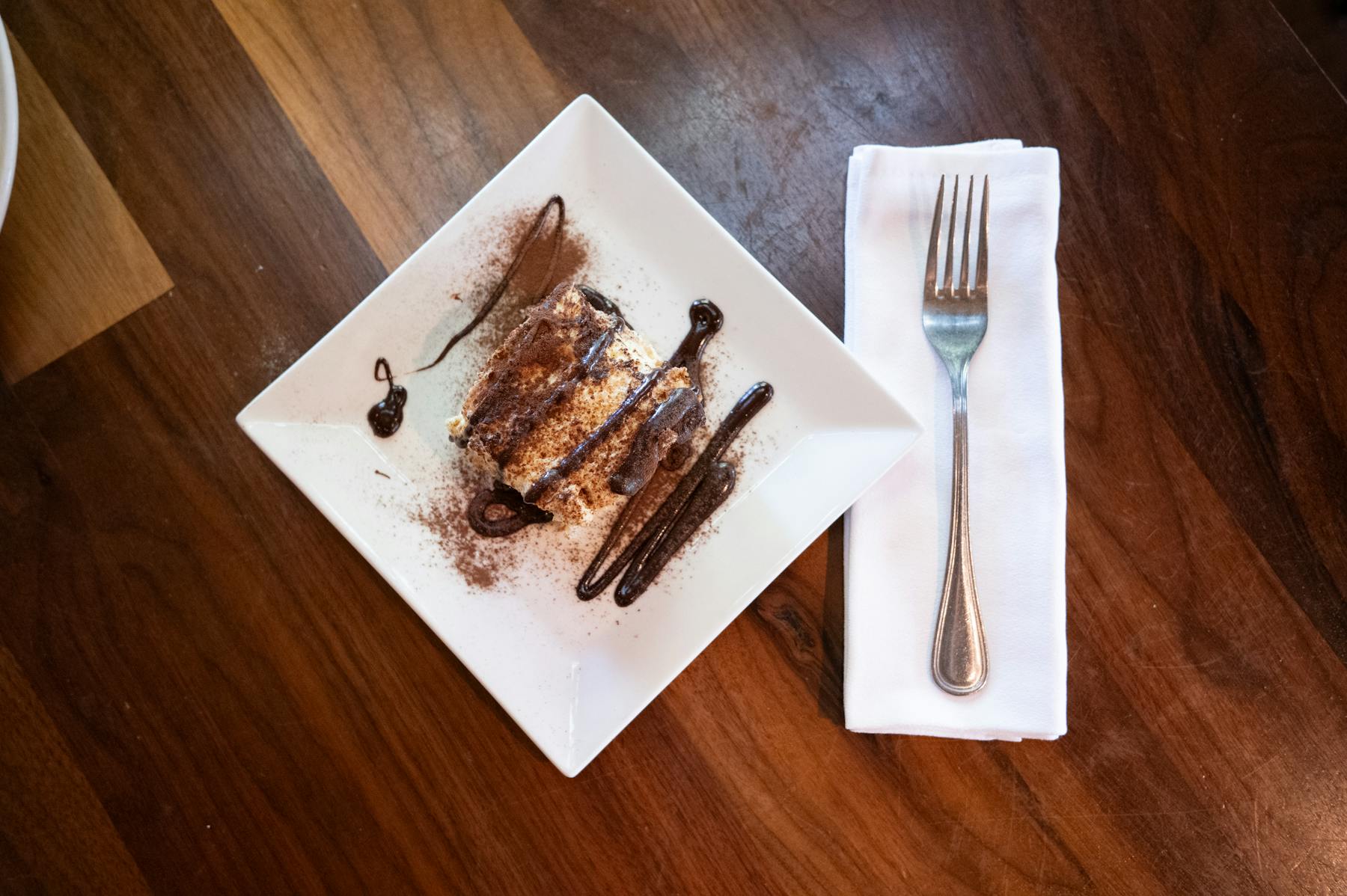 a piece of cake sitting on top of a wooden table