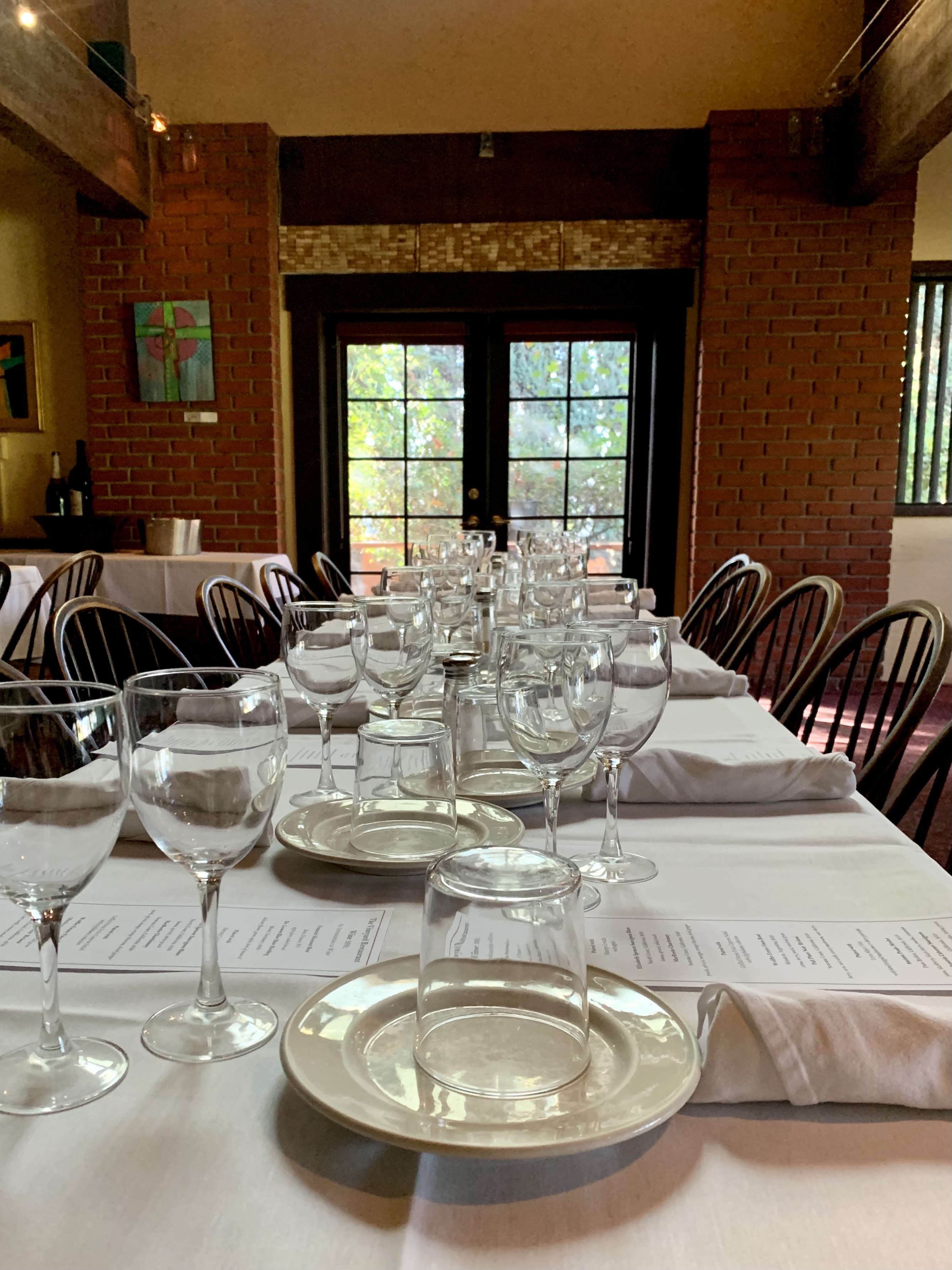 a dining table filled with wine glasses