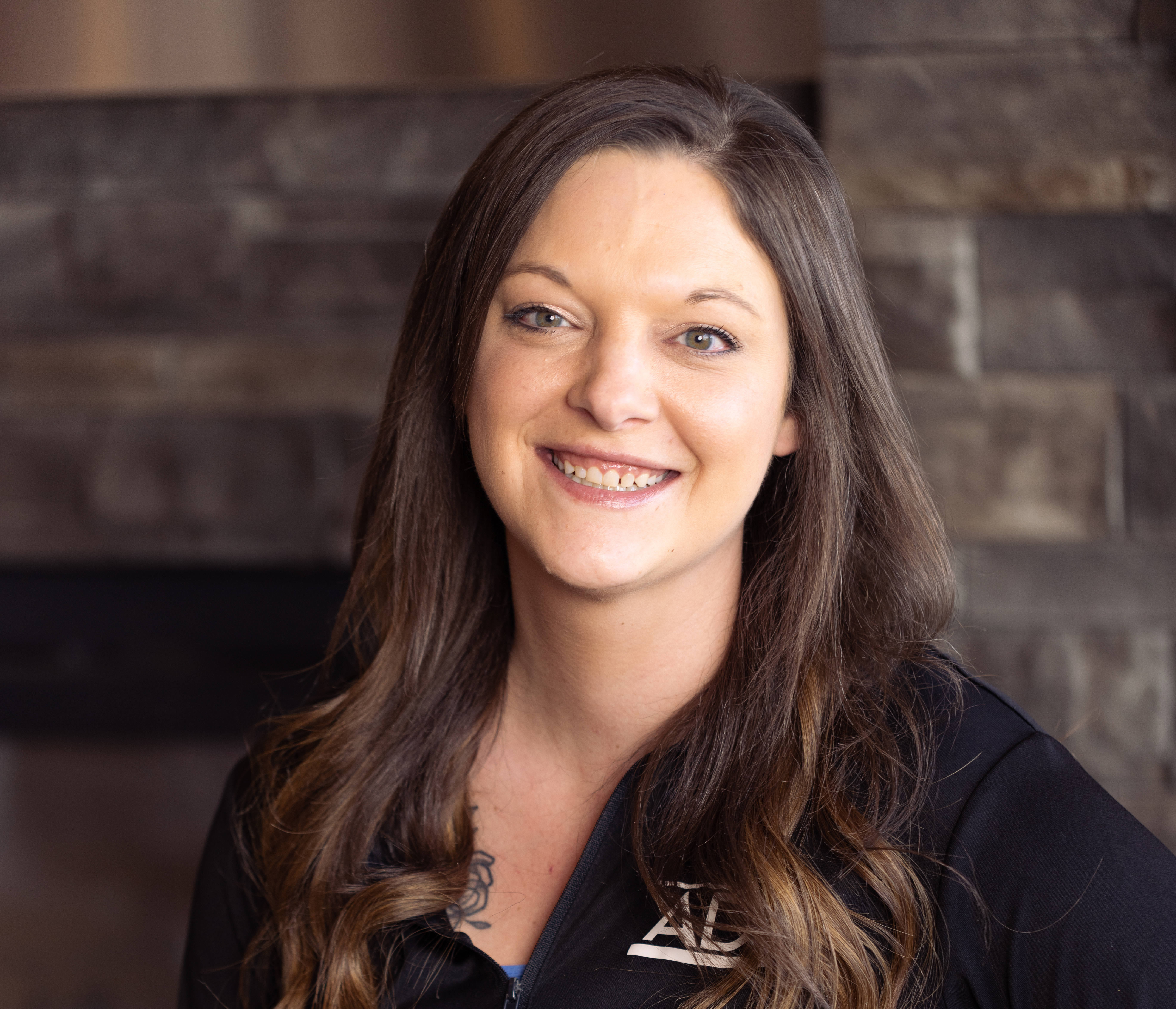 a woman smiling for the camera