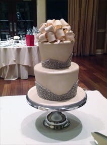 a large white cake sitting on top of a table