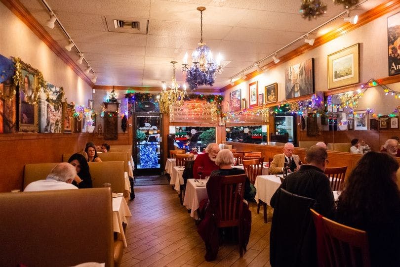 a group of people sitting at a table in a room