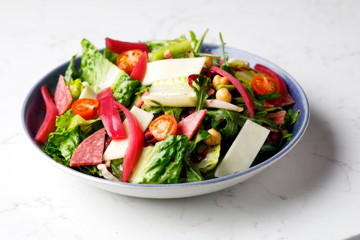 a bowl of salad on a plate
