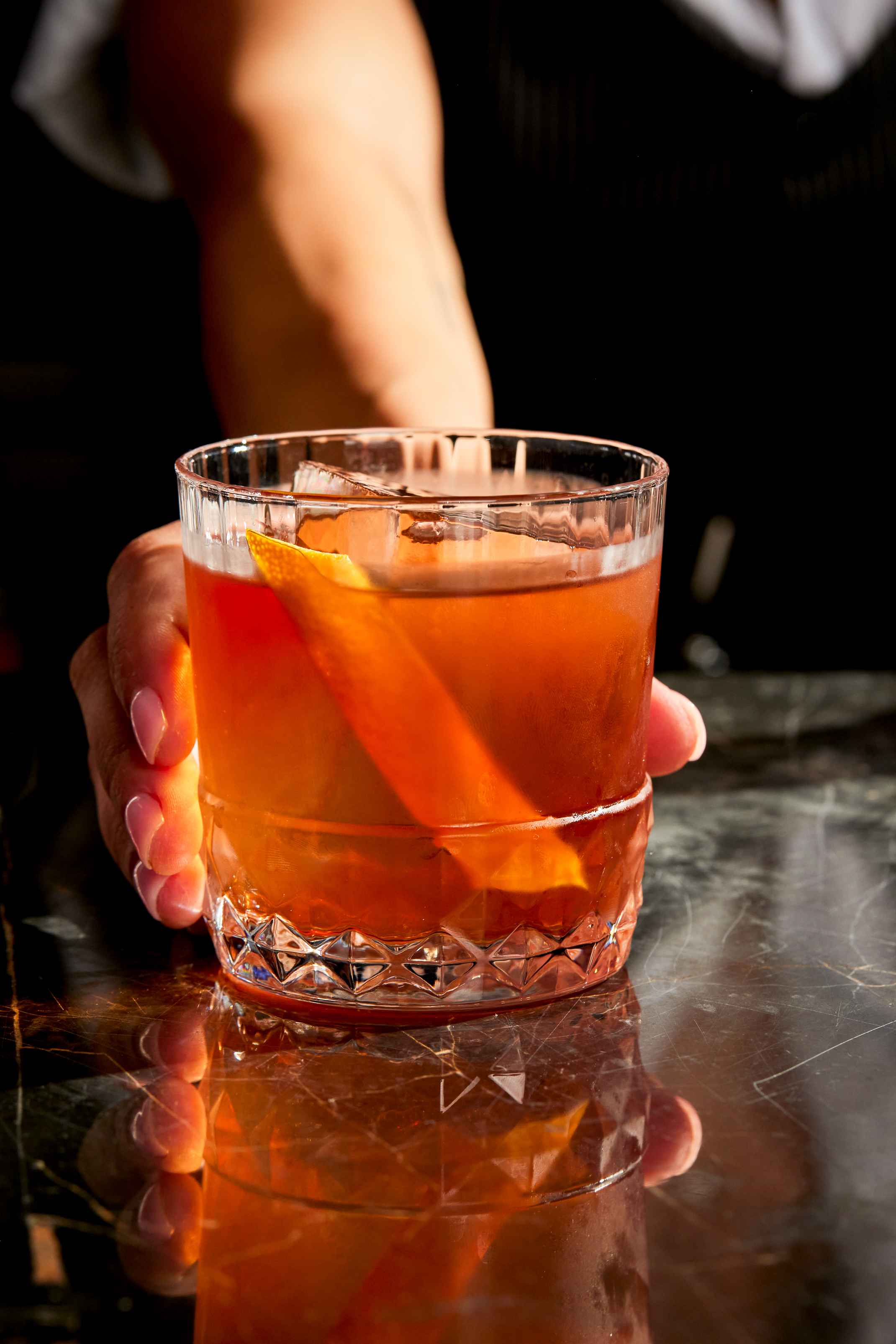 a close up of a glass of beer on a table