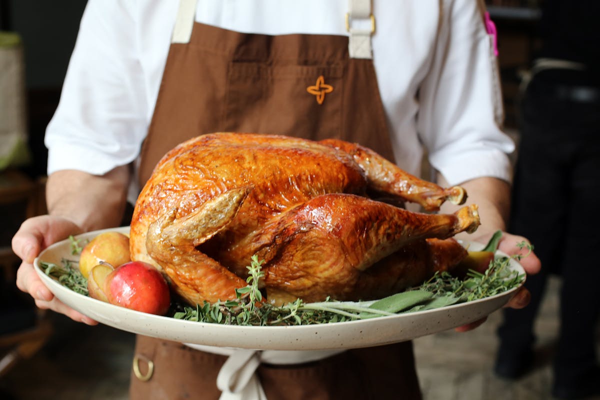a person holding a bowl of food