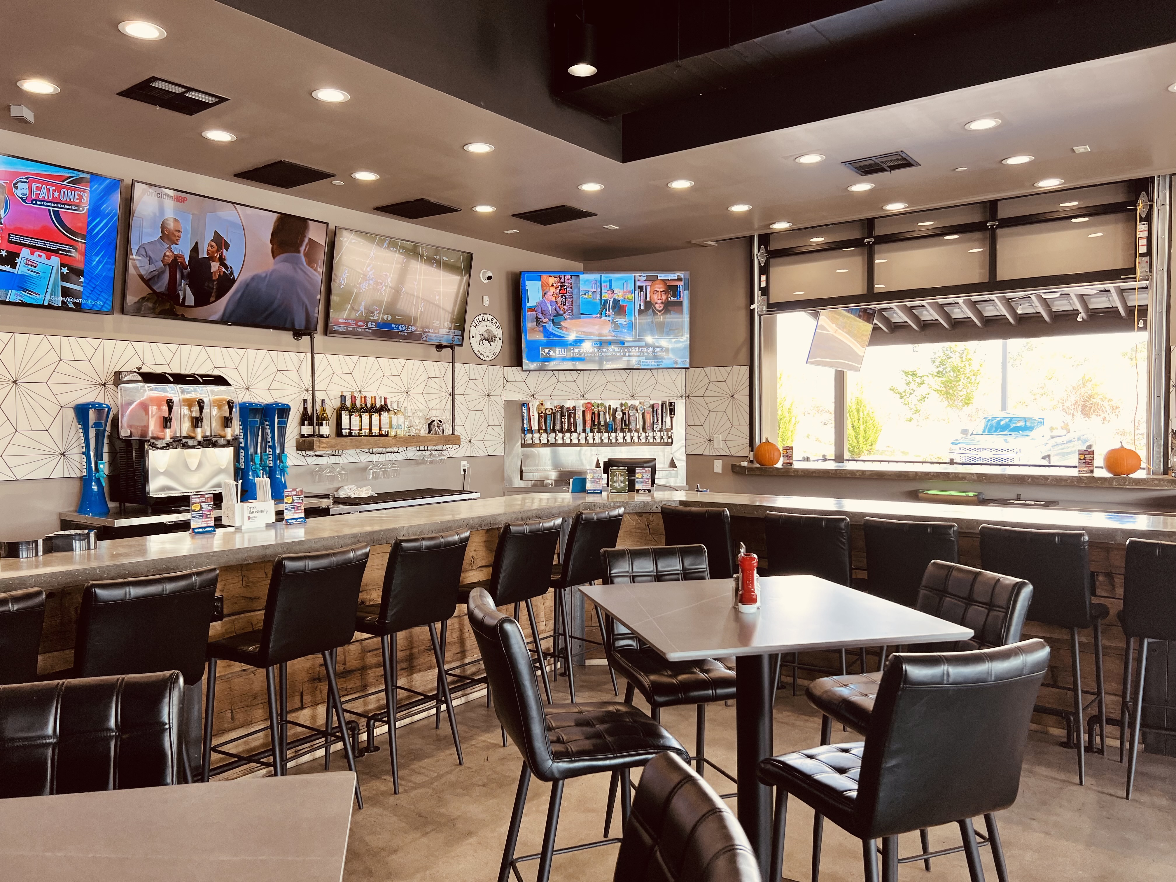 a room filled with furniture and a table in a restaurant