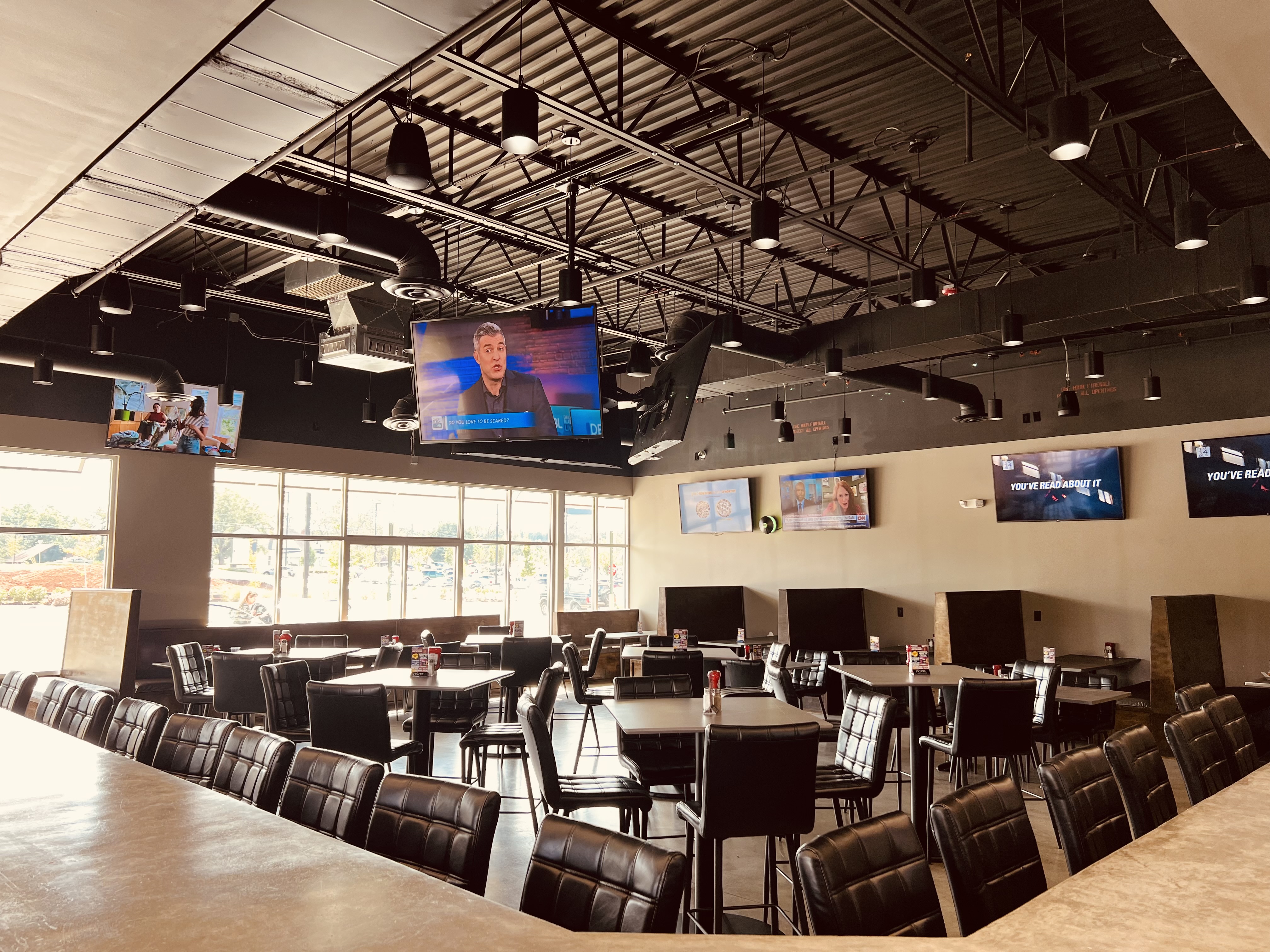 a room filled with furniture and a flat screen tv