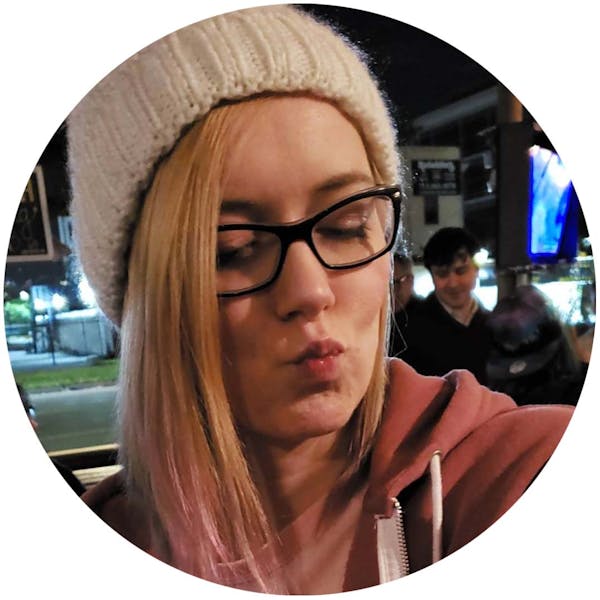 a person wearing a hat and glasses