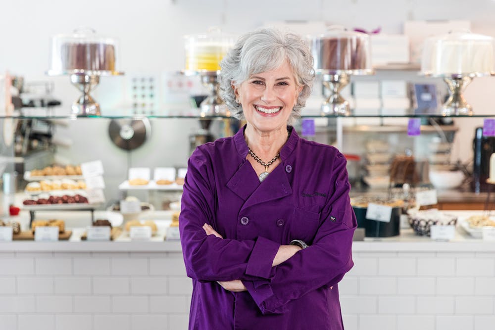 a woman standing in a kitchen