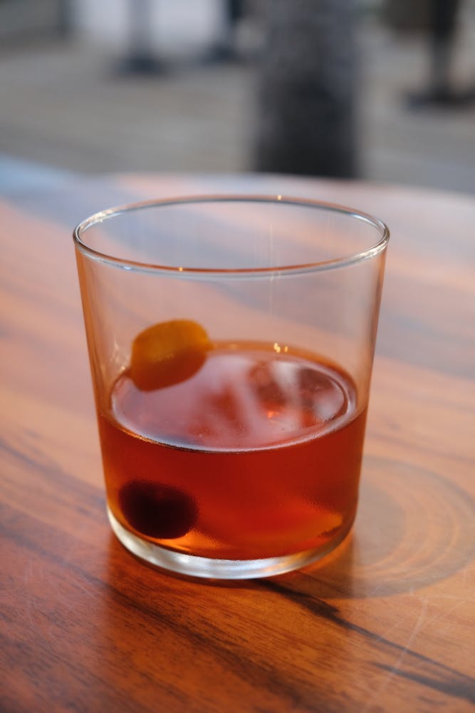 a close up of a glass of beer on a table