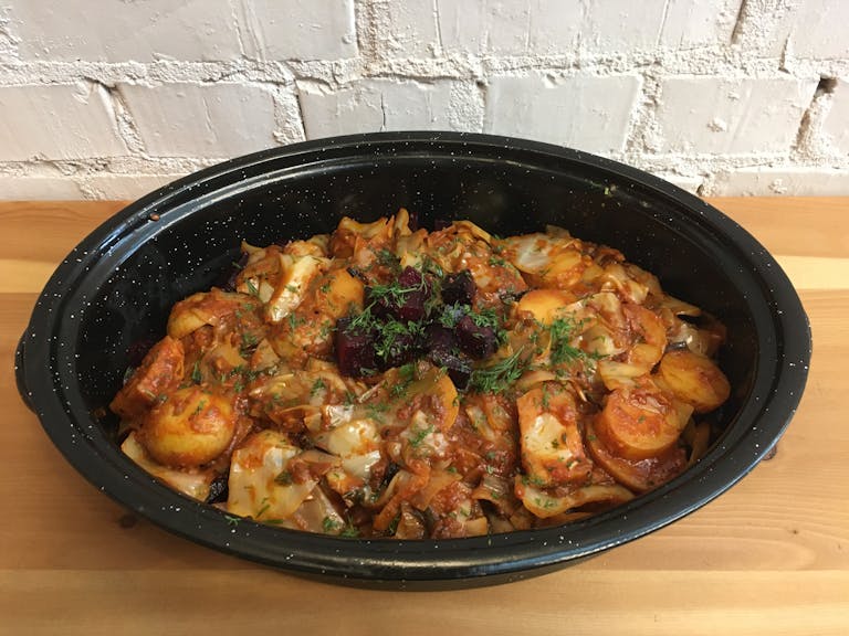 a bowl of food sitting on a pan