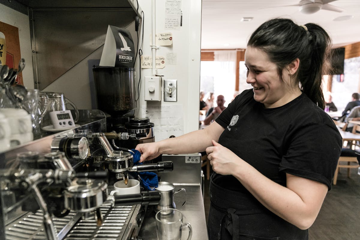 a person making coffee