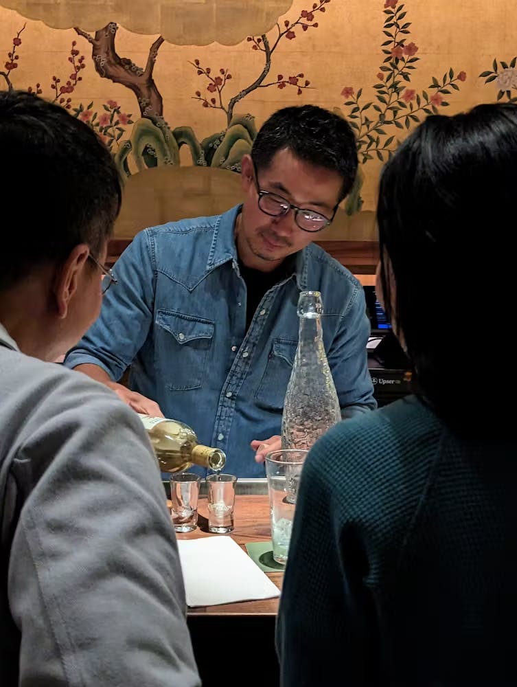 a group of people sitting at a table