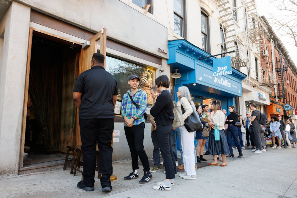 a group of people sitting at a table in a restaurant