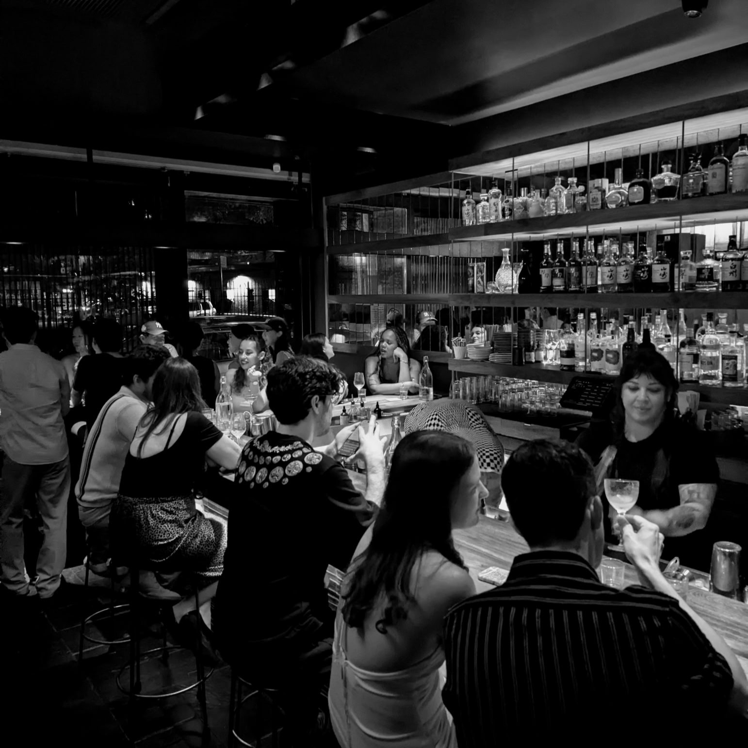 a group of people standing in front of a store