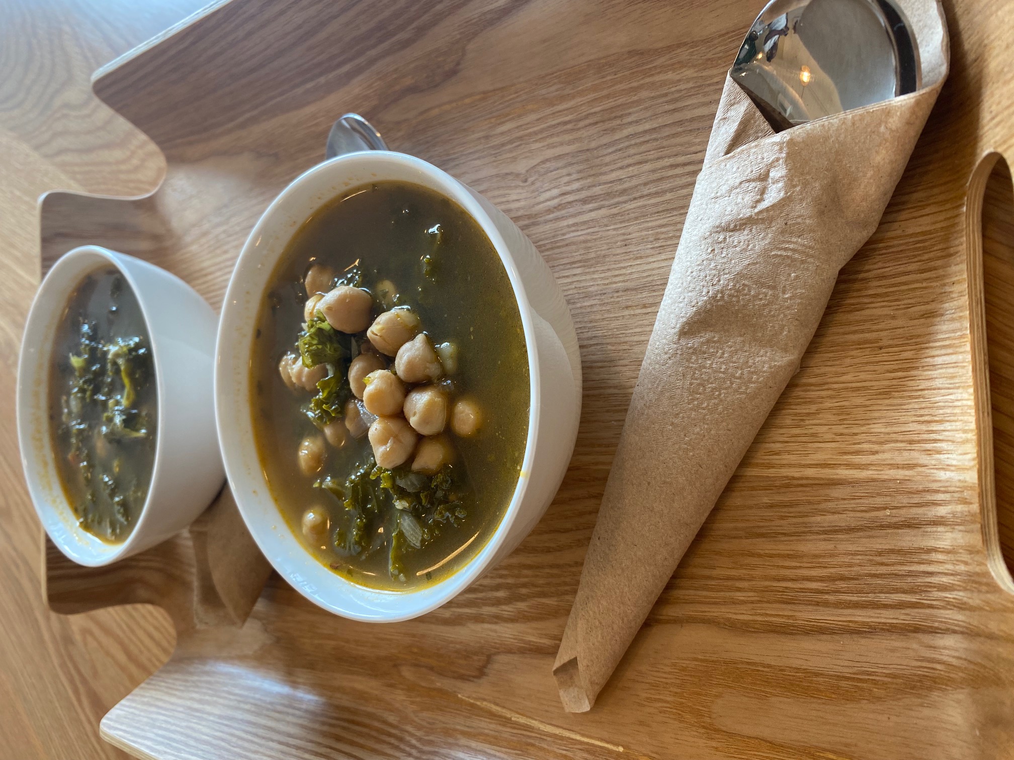 a bowl of food sitting on top of a wooden table