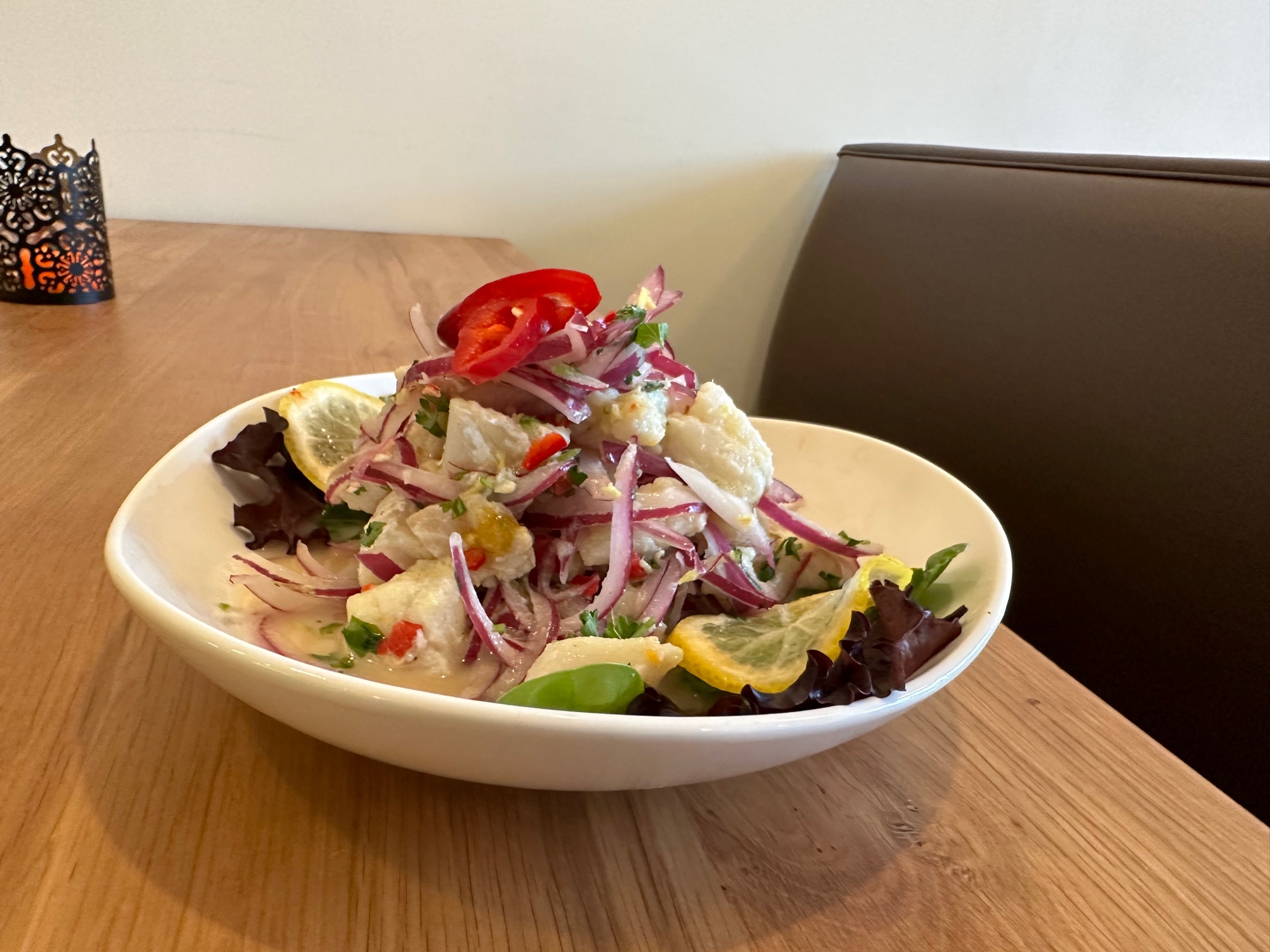 a bowl of salad on a plate