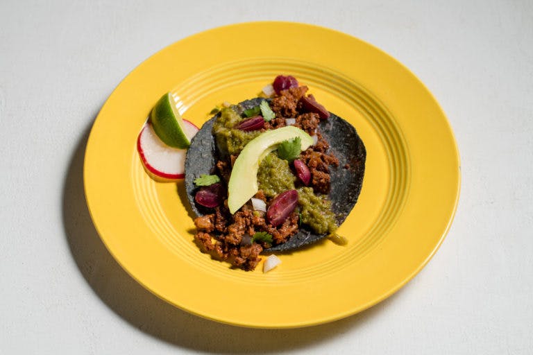 a blue tortilla taco on a plate