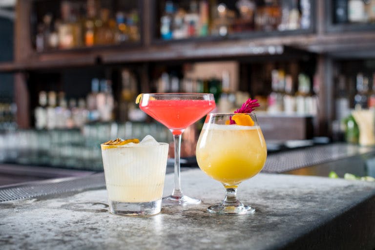 a close up of three drinks