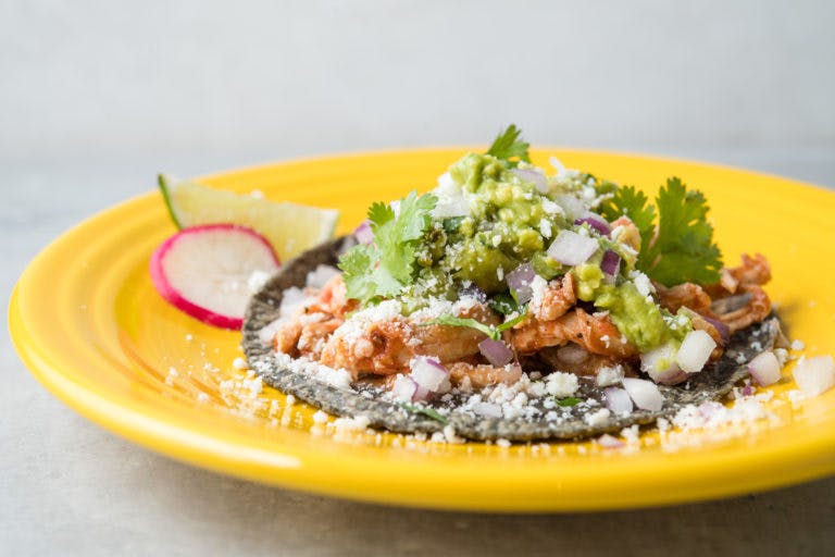 a blue tortilla taco on a plate